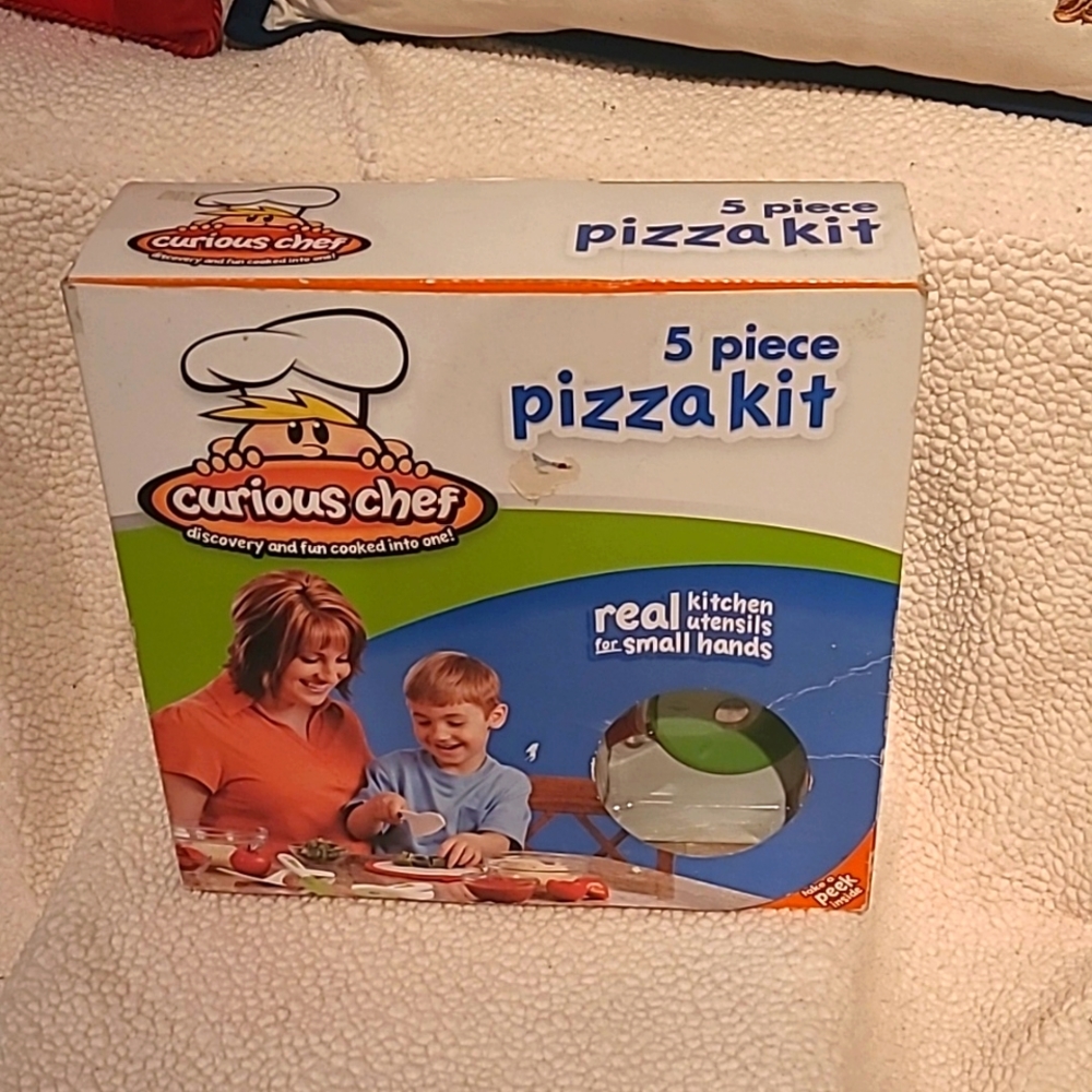 Curious chef 5 piece pizza kit.  Real kitchen tools for kid chefs